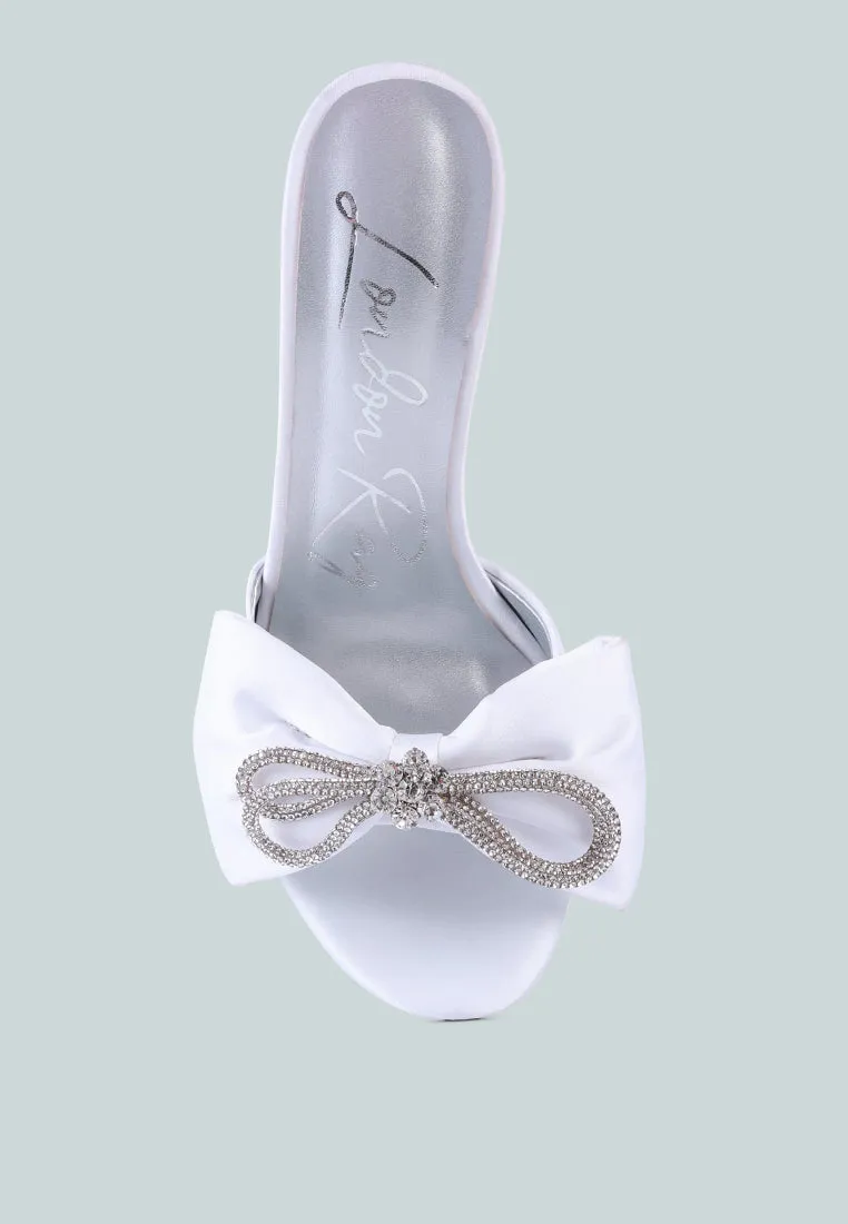 Brag in rhinestone embellished bow satin heels