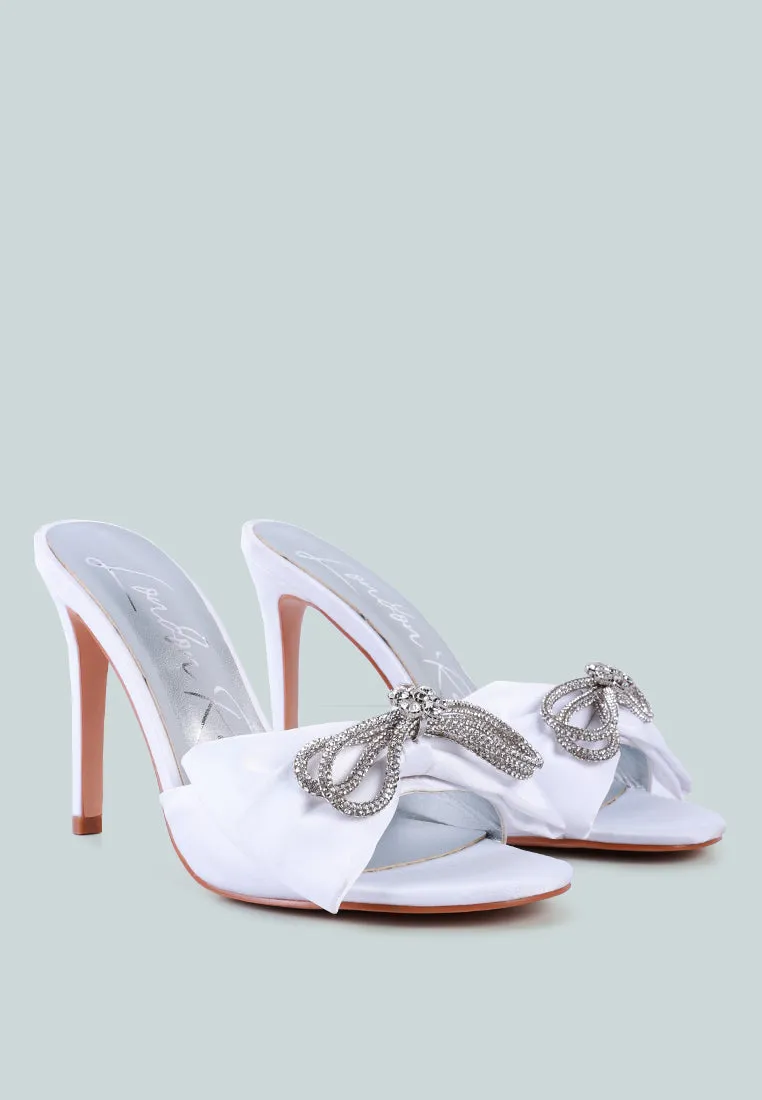 Brag in rhinestone embellished bow satin heels
