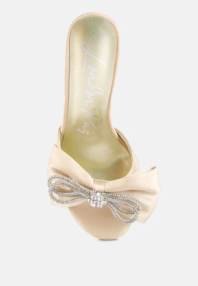 Brag in rhinestone embellished bow satin heels
